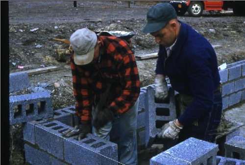 Lay block for the Chester Little League Field building under construction in the lot west of Conklin’s Lumber Yard. Left: Pat Bailey. March, 1958 chs-009250