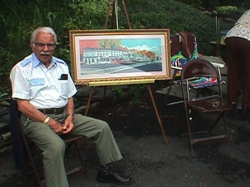 Tom LaBarbera and print of his Uptown painting at the Yard Sale 22 July 2000 MVC-007F.jpg