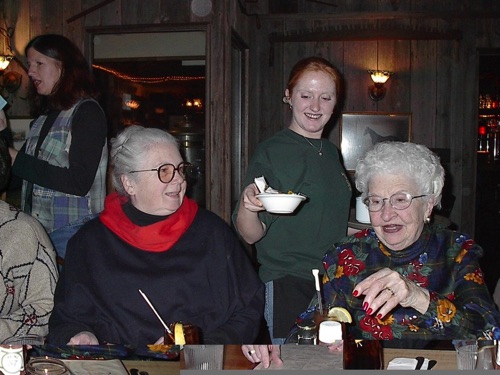 Debbie (in background) Leslie, waitress, & Lorraine at Barnsider Dutch Treat Dinner 11/20/2001 V0010051