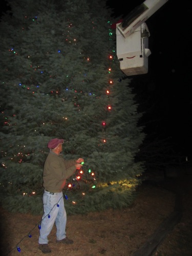 2013-11-14 Bill feeds lights unto Jim, in Greenwood Tree Service bucket. IMG_4302.JPG