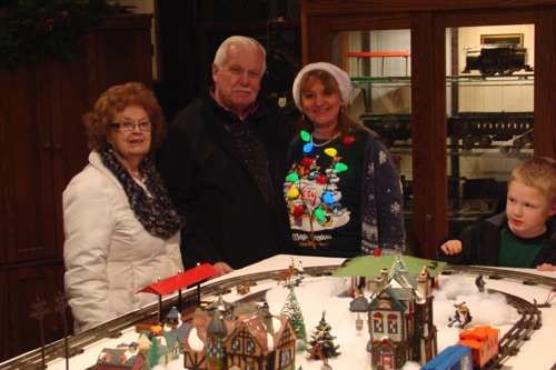 Joan, Fred & Debby-Lu the trains under the direction of the young engineer.  2015-12-06 (Photo by Leslie) DSC05727.jpg