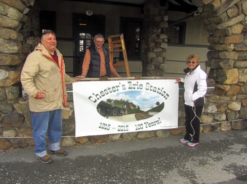 Cliff, Rob, Norma & Ed posing with the 1915-2015 Chester Erie Station 100 Years banner, donated by Kent at MacMedia. 2015-03-21 IMG_5103.jpg
