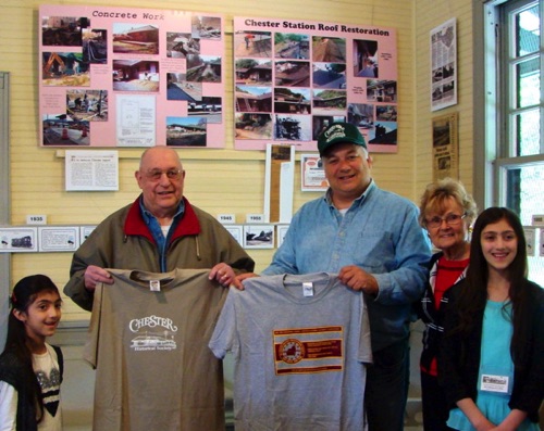 Julio Pettiti, President, Tri-States Railway Preservation Society officially exchange Society t-shirts with Rob Held, VP, Chester Historical Society. Aisha , Norma and Alia looking on. Photo by Leslie. 2016-05-07 DSC06594A